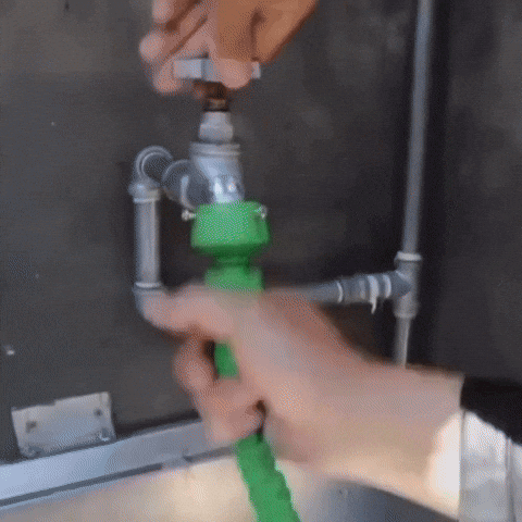 SprayMaster: Manguera extensible con pistola de 7 funciones